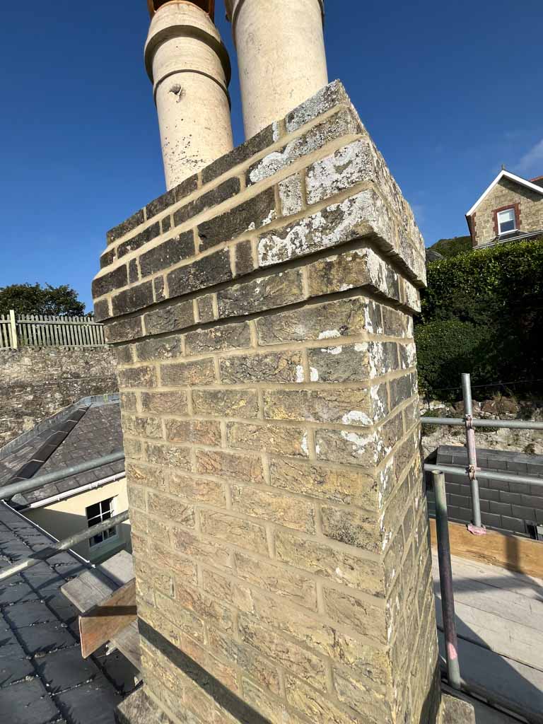 Stone chimney with twin chimney pots