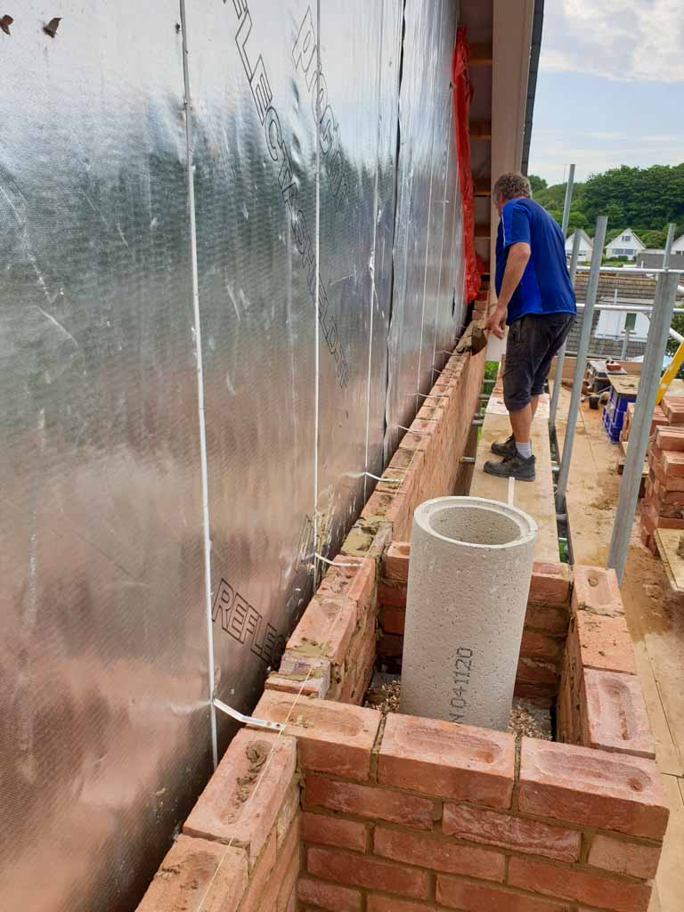 Brickwork under construction beside a building